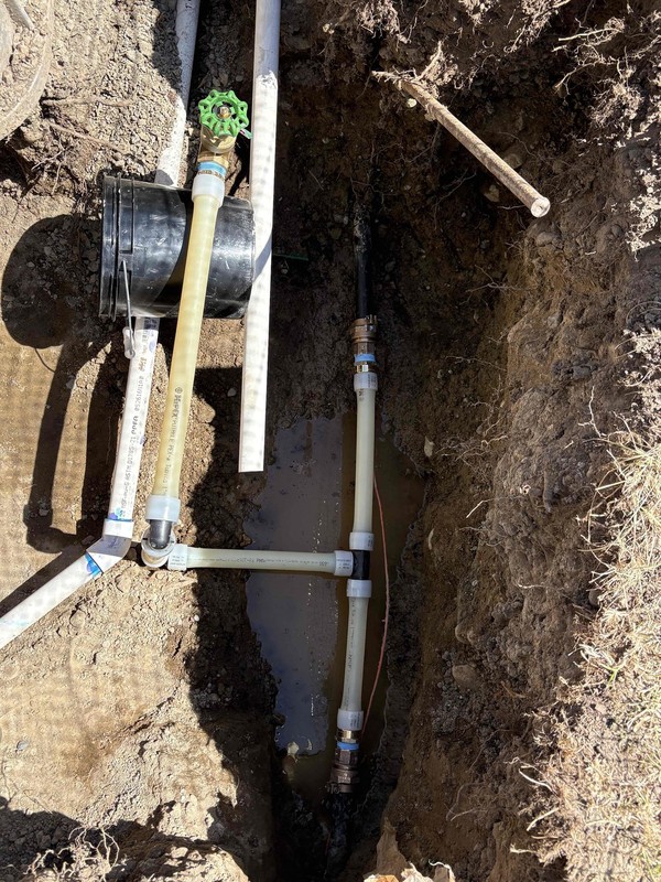 New 1-inch brass gate valve irrigation shutoff installed on PEX piping in an Arlington, WA yard