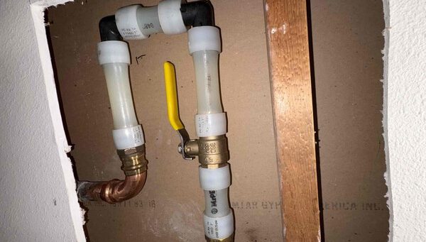 New 3/4-inch brass ball valve installed as the main water shut-off in an opened wall in Kirkland, WA