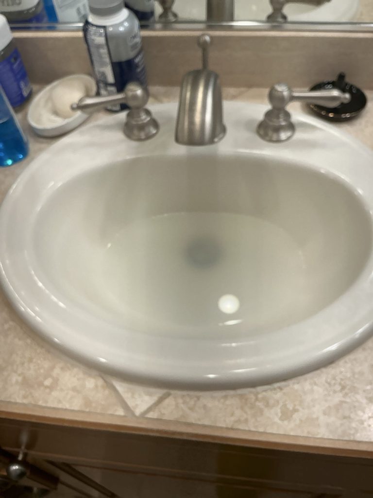 Master bathroom sink holding standing water and refusing to drain in a Kirkland, WA home