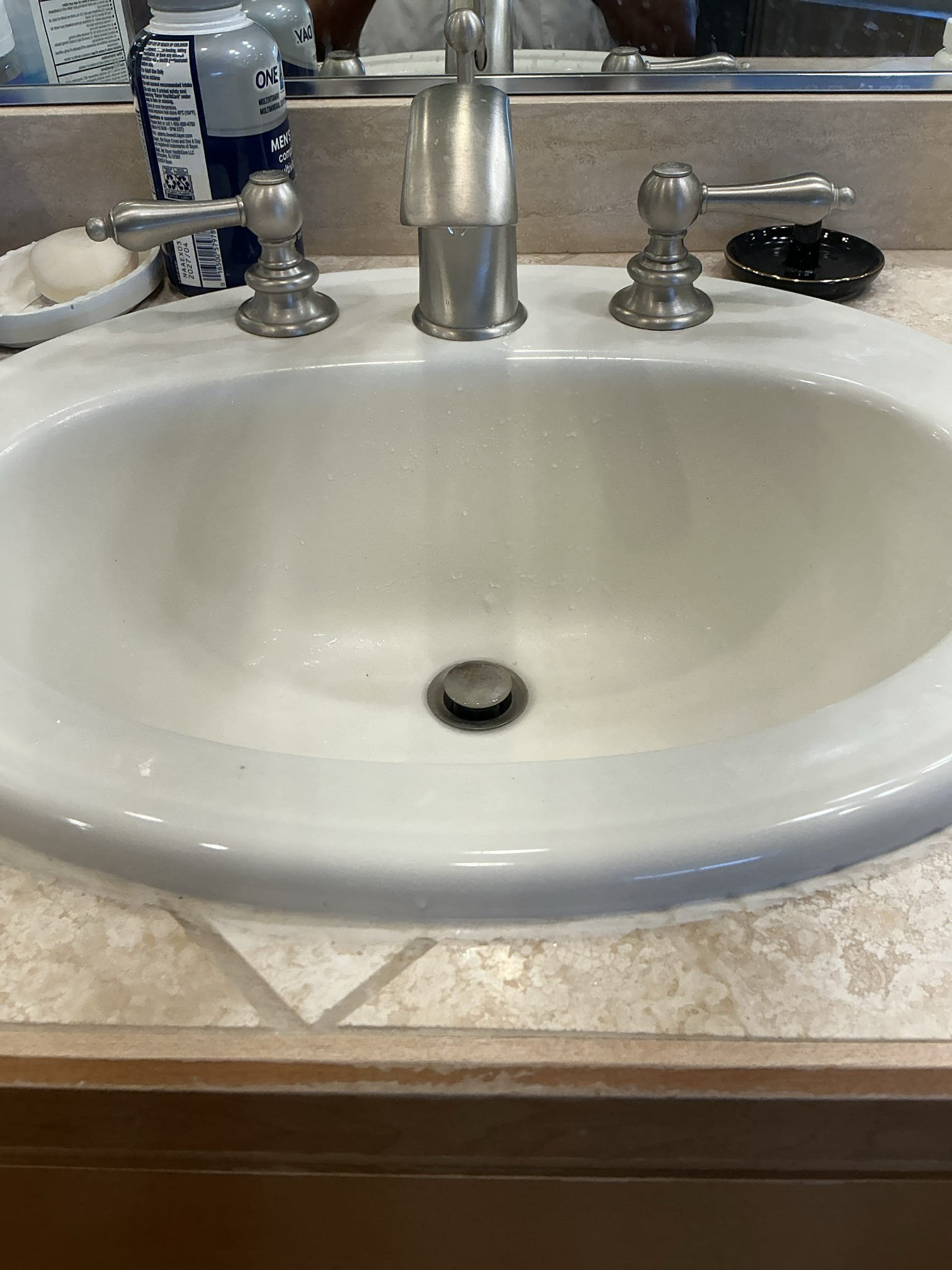Clean master bathroom sink draining freely after the P-trap was reinstalled and the line cleared in Kirkland, WA